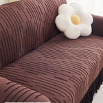 Copertura per divano jacquard con volant per una protezione elegante