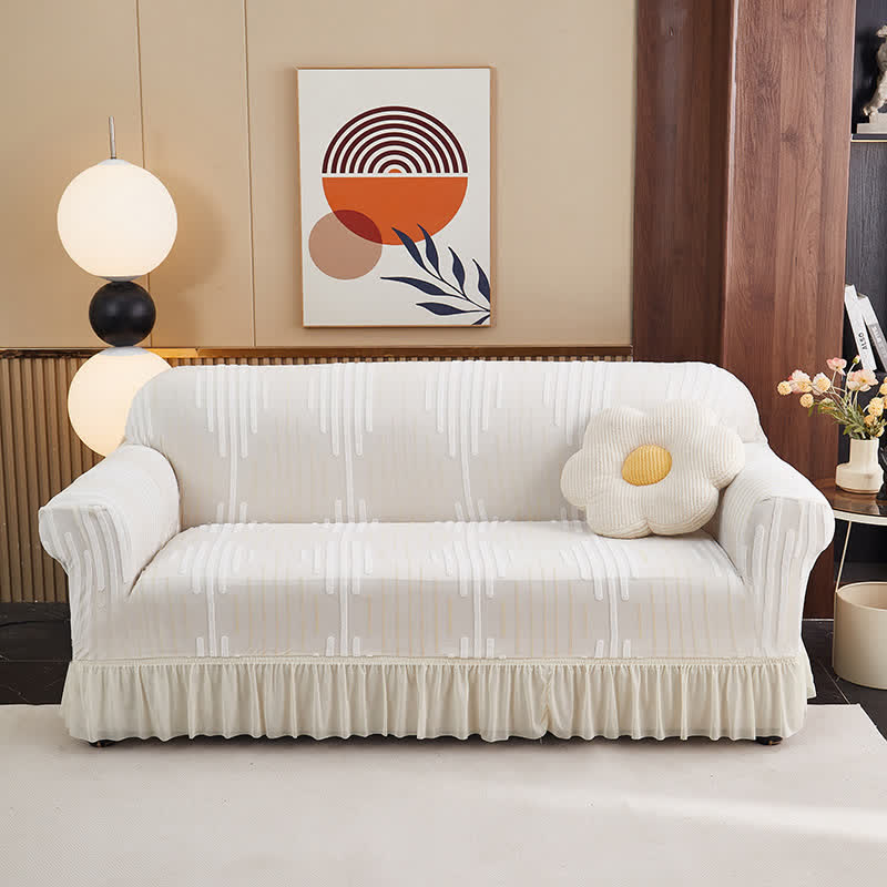 Copertura per divano jacquard con volant per una protezione elegante