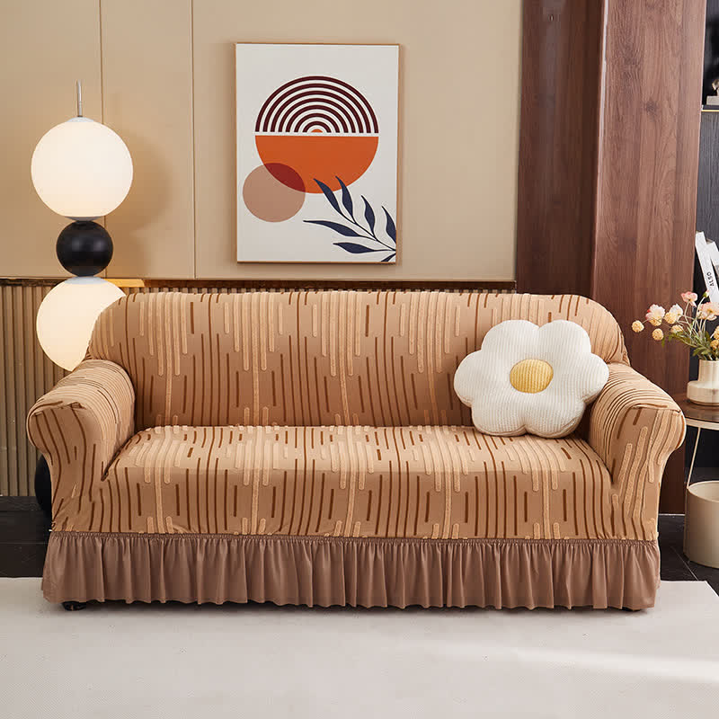 Copertura per divano jacquard con volant per una protezione elegante