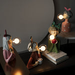 Figürliche Tischlampe mit künstlerischem Charakter