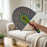 LISTINGOPT::kovosis::2025-new-hot-selling-seagrass-woven-straw-fan-wall-hanging-african-element-wind-wall-decoration-daily-summer-hand-crank-pu::02-inuse