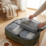 LISTINGOPT::kovosis::4pcsset-compressible-packing-travel-storage-bag-cubes-waterproof-suitcase-portable-with-handbag-luggage-organizer::02-inuse