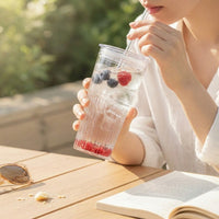 LISTINGOPT::kovosis::600ml-striped-glass-cup-with-lid-straw-transparent-drinking-glass-for-juice-iced-coffee-water-outdoor-drinkware::02-inuse