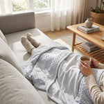 LISTINGOPT::kovosis::emotional-cooling-blanket-for-relaxation-soundwave-technology-embossed-striped-design-with-ball-accents-breathable-lightweight-summer-throw-machine-washable-wrinkle-resistant-multi-use-blanket-and-shawl-in-white-and-grey-random-color::02-inuse