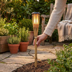 LISTINGOPT::kovosis::flameglow-solar-bamboo-led-lights-for-outdoor-ambiance::02-inuse