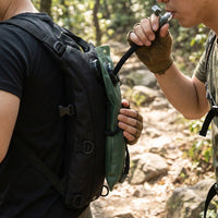 LISTINGOPT::kovosis::hydration-backpack-with-10144oz-water-bladder-tactical-water-bag-lightweight-withadjustable-straps-large-capacity-for-hiking-biking-running-climbing-black-hikingbackpack::02-inuse