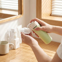 LISTINGOPT::kovosis::pourpod-4-in-1-dispensing-travel-bottle::02-inuse